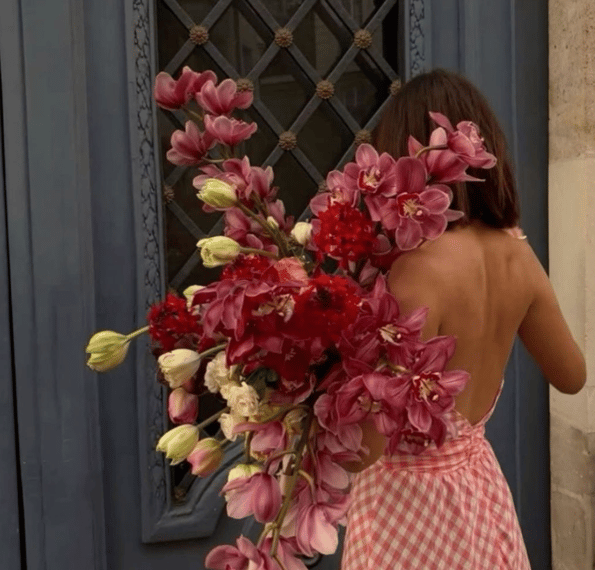 Woman holding a beautiful flower bouquet – Digital Marketing for Florists